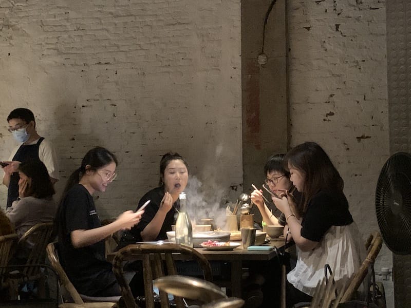 Diners dig into their meal (and photograph it!) at Maolago, photo by Jamie Barys