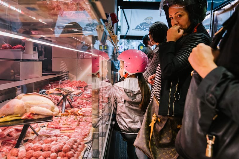 NAPLES, ITALY - 30 MAY 2019: Customers are seen here at D'Ausilio, a butcher shop in Naples, Italy, on May 30th 2019.<br /> Raffaele D’Ausilio comes from a family of butchers. His grandfather, Alfredo d’Ausilio, opened a butcher shop in 1947. All four of his children became butchers, including Raffaele’s father Vincenzo. In the early 2000s, Raffaele and his wife Roberta took over the family business with their touch of innovation: a butcher shop during the day, a take-away burger shop at night.