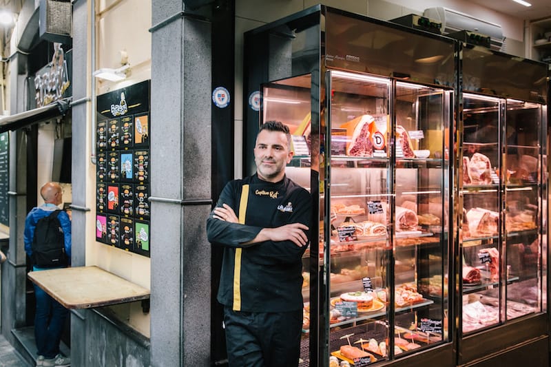 NAPLES, ITALY - 30 MAY 2019: Raffaele D'Ausilio (38, aka Capitano Raf) poses for a portrait in front of D'Ausilio Macelleria &amp; Burgheria, a butcher shop in Naples, Italy, on May 30th 2019.<br /> Raffaele D’Ausilio comes from a family of butchers. His grandfather, Alfredo d’Ausilio, opened a butcher shop in 1947. All four of his children became butchers, including Raffaele’s father Vincenzo. In the early 2000s, Raffaele and his wife Roberta took over the family business with their touch of innovation: a butcher shop during the day, a take-away burger shop at night.