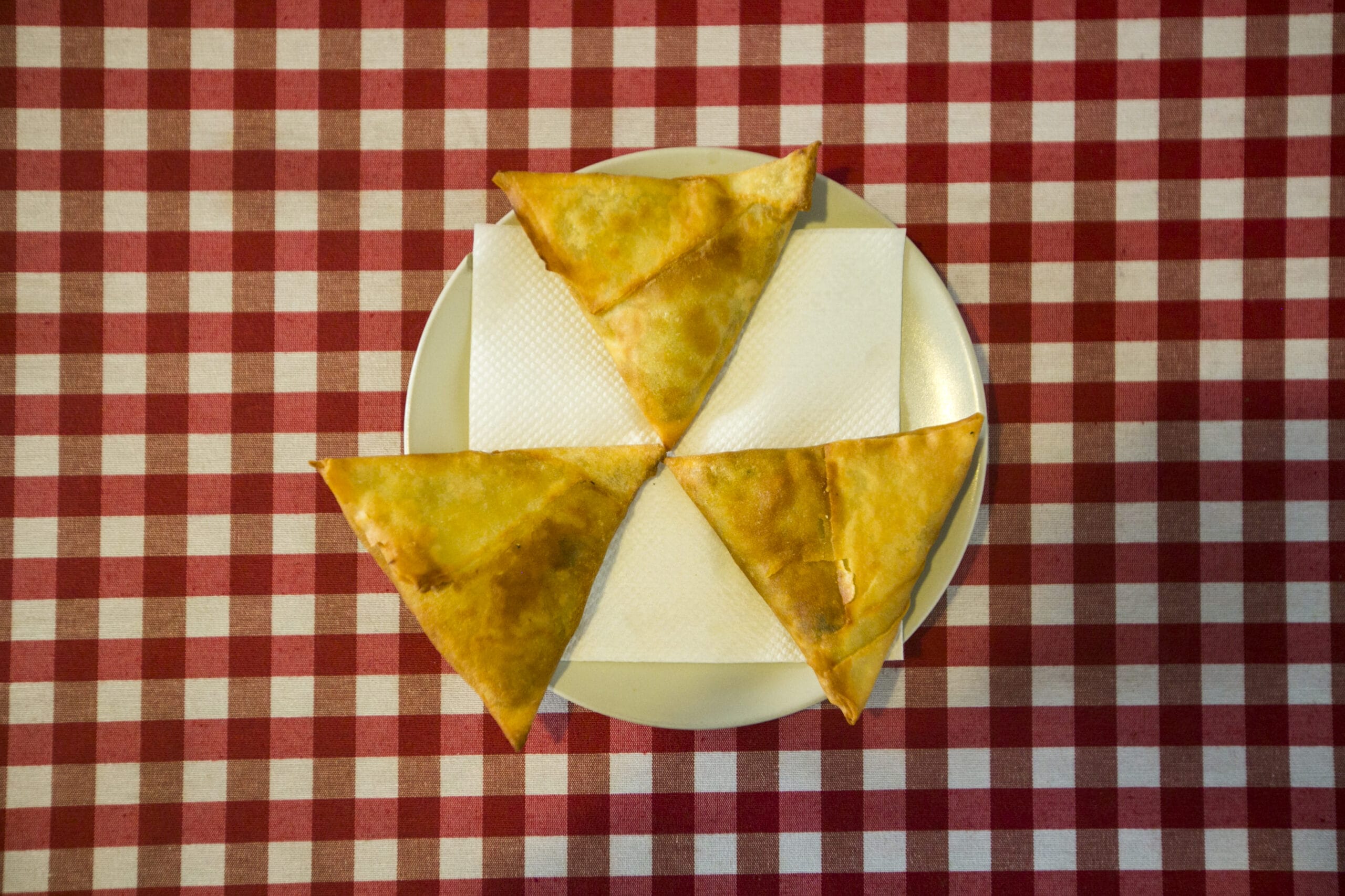 Learn the history folded into Lisbon's favorite bar snack, the Goan samosa