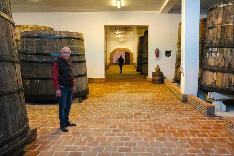 Anka-GujanidzeUNDP-of-the-old-Soviet-oak-barrels-in-Royal-Khvanchkara-wine-factory