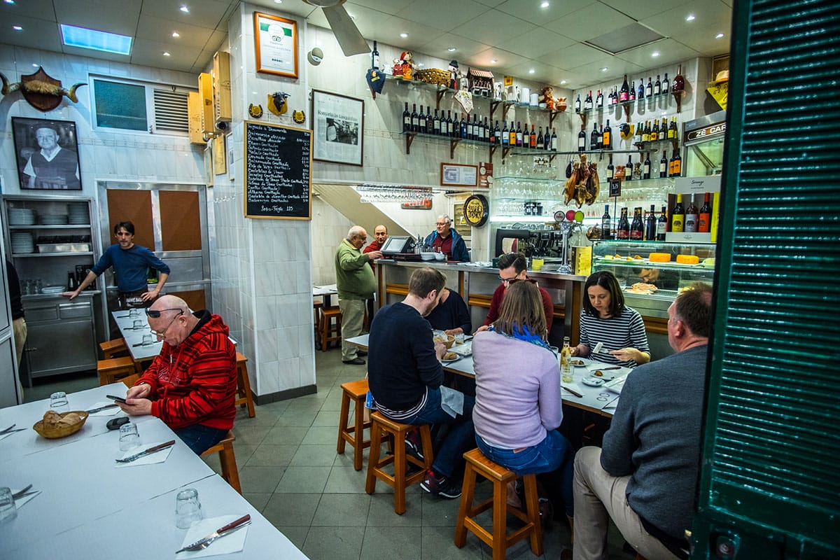 Sit down at one of Lisbon's classic tascas, beloved neighborhood culinary institutions