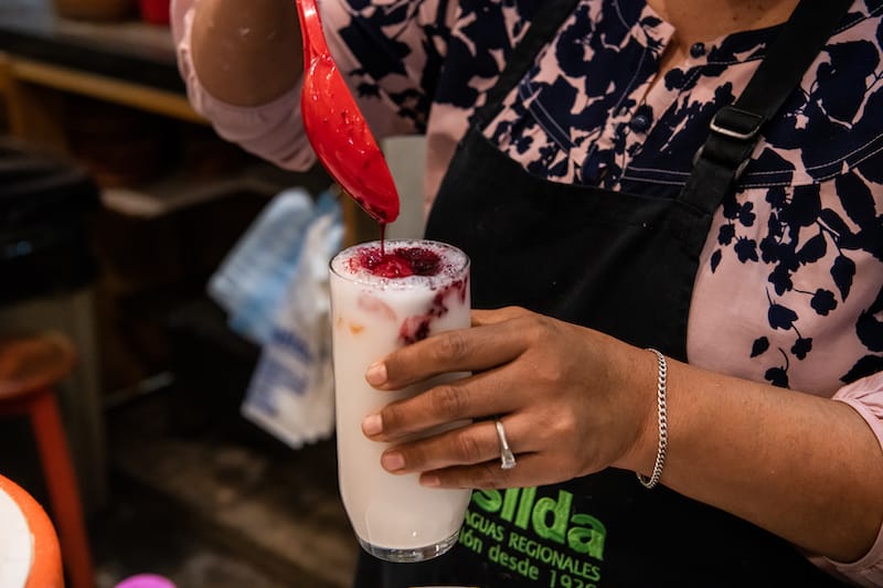 Adding prickly pear to horchata, photo by Jalil Olmedo