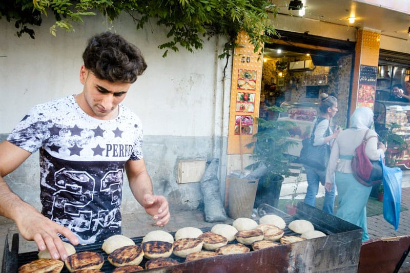Putting kibbeh on the grill outside Bawabat Istanbul, photo by Karim Mostafa