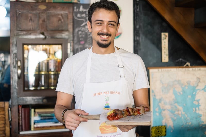 A waiter at Hohlidaki carries one of their creative mains, photo by Manteau Stam