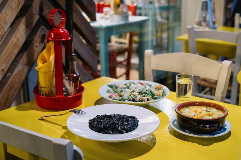 A sampling of dishes, including black-ink risotto, at Psarokokkalo, photo by Manteau Stam