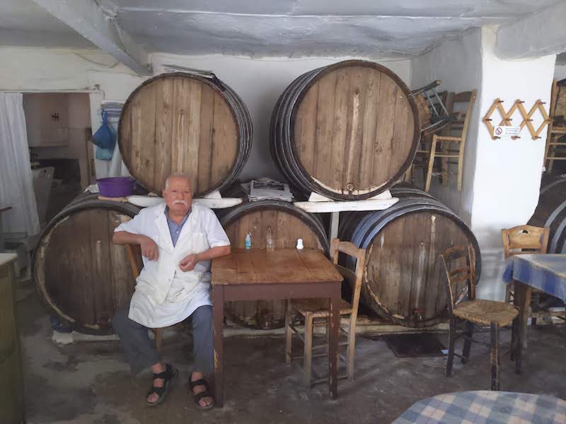 Diporto is dark, with a faded concrete-block mosaic floor and one wall covered in wine barrels, which, unlike at most Athenian taverns, are not meant purely for décor but are actually used to store wine, photo by Tas Anjarwalla