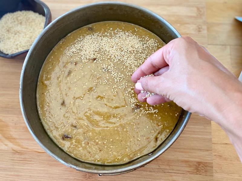 Sesame seeds, which symbolize abundance, are sprinkled on top of the fanouropita, photo by Carolina Doriti