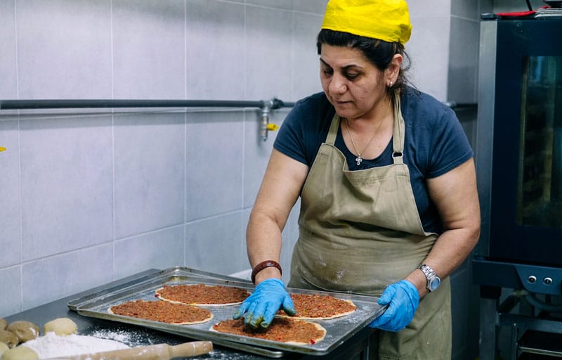 Making lahmacun at Feyrouz, photo by Manteau Stam