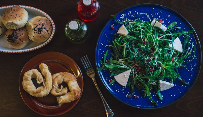 Kaltsounia pie and sautéed stamnagathi at Katsourbos, photo by Manteau Stam
