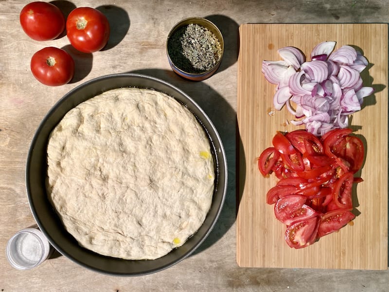 Preparing to put the toppings on the dough, photo by Carolina Doriti prepping ladenia recipe