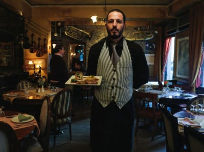 A waiter at Magemenos Avlos, photo by Manteau Stam