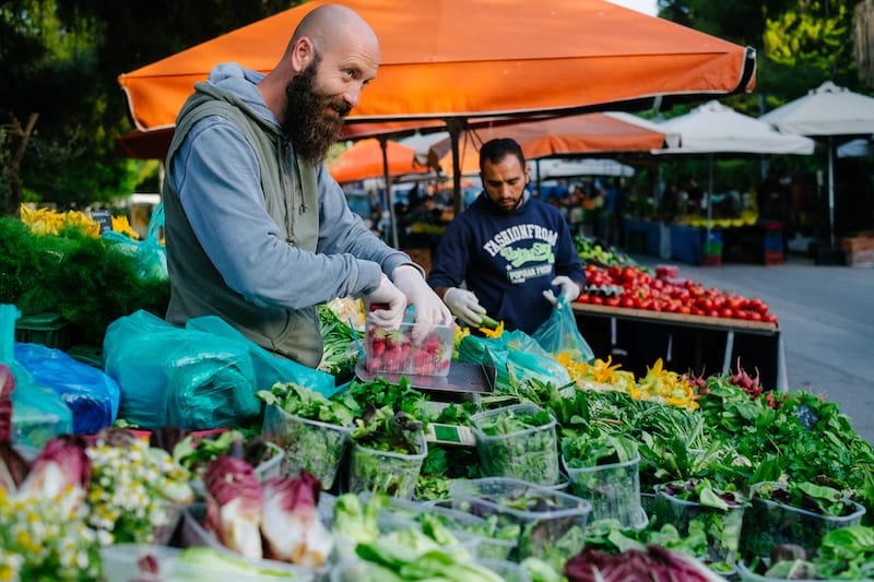 Christos Mplantis at his stall in the farmer’s market, photo by Manteau Stam