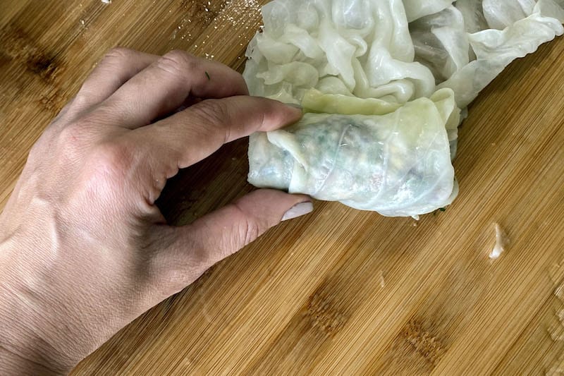 Wrapping the stuffed cabbage leaves, photo by Carolina Doriti