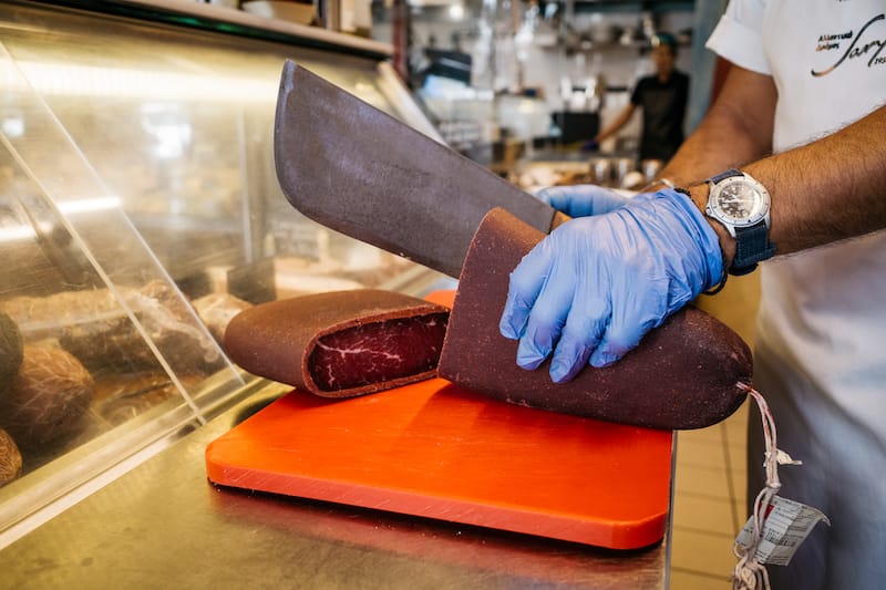 Slicing pastourma at Ta Karamanlidika tou Fani – The Workshop, photo by Manteau Stam