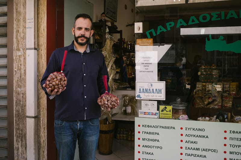 Dimitris Katakis in front of To Mitato tou Psiloriti, the small Cretan deli he runs in Athens, photo by Manteau Stam