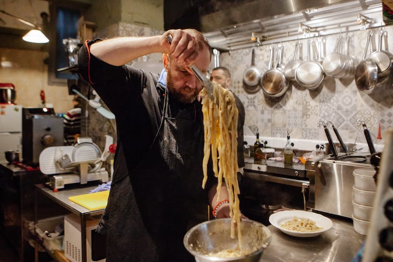 Onofrio Ioakimidis tosses some of his homemade pasta at Trattoria Italia D’Onofrio, his restaurant in Athens, photo by Manteau Stam