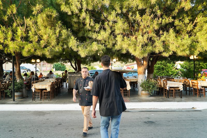Crossing the street to bring an order to the table, photo by Katherine Whittaker