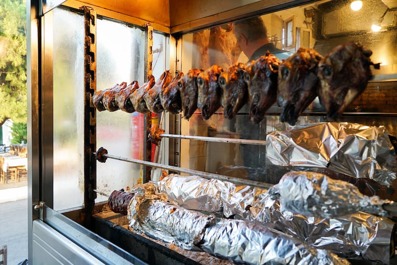 Lamb heads rotate over coals at Trigono, photo by Katherine Whittaker