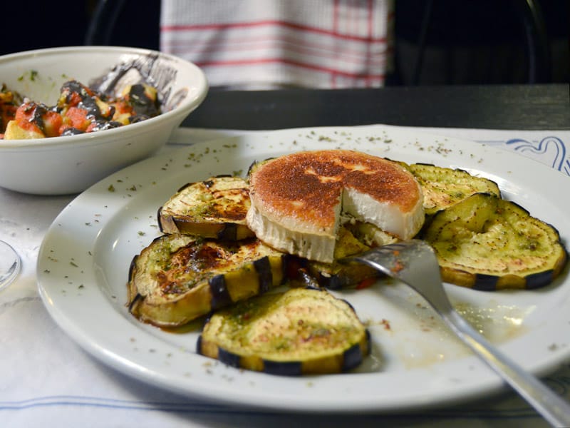 Anarcos bravas and eggplant with goat cheese at Bodega Manolo, photo by Paula Mourenza