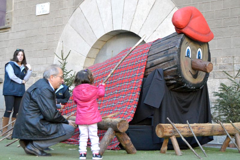 Beating the Caga Tío (a particularly large specimen) to get some Christmas presents, photo by Paula Mourenza