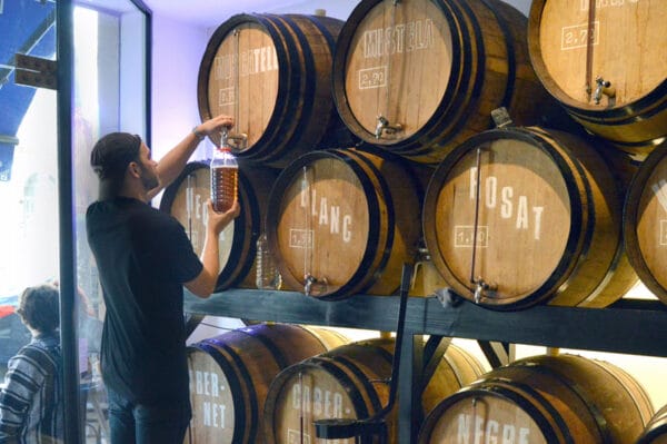 Filling a jug at Casa Mariol, photo by Paula Mourenza