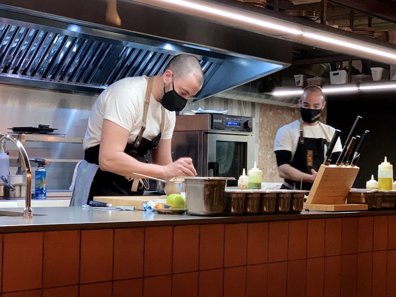 Chefs Javier San Vicente and David López performing their northwestern magic in the open kitchen of Taberna Noroeste, photo by Paula Mourenza
