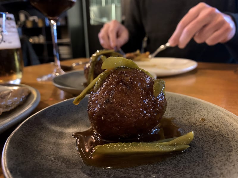 The celebrated crispy croquette-bomb of cocido at Taberna Noroeste, photo by Paula Mourenza