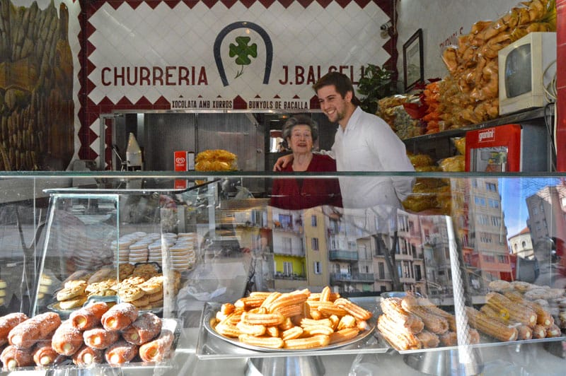 Cecilia Martínez with her grandson Alex at Xurreria El Trebol, photo by Paula Mourenza