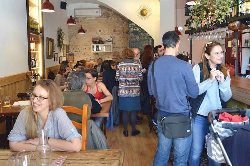 The crowded dining room of Mala Hierba, photo by Paula Mourenza