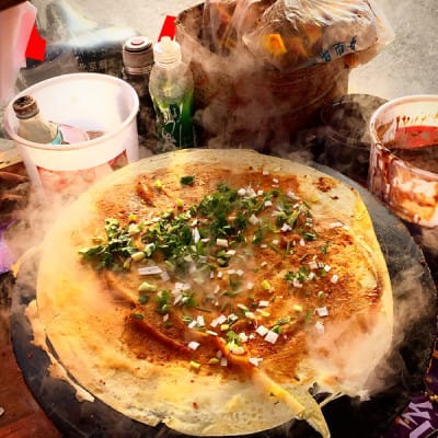 The savory crêpe known as jianbing, made from a mung bean batter, photo by Lillian Chou