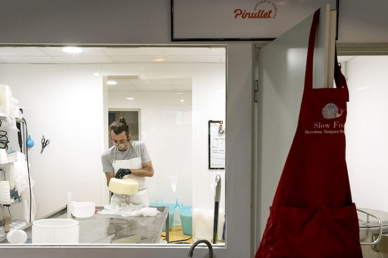 Cheesemaker and monger Francesco Cerutti is at work at his urban cheese shop, Pinullet, photo by Paula Mourenza