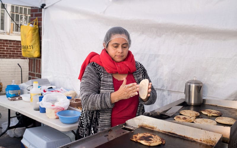 Maria Elena, making pupusas at Iglesia La Luz del Mundo, photo by Melanie Einzig