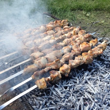 Mtsvadi, Georgian barbecue, being cooked over grape vine cuttings, photo by Paul Rimple