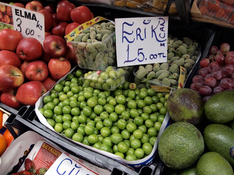 Green plums and almonds for sale in an Istanbul market, photo by Yigal Schleifer
