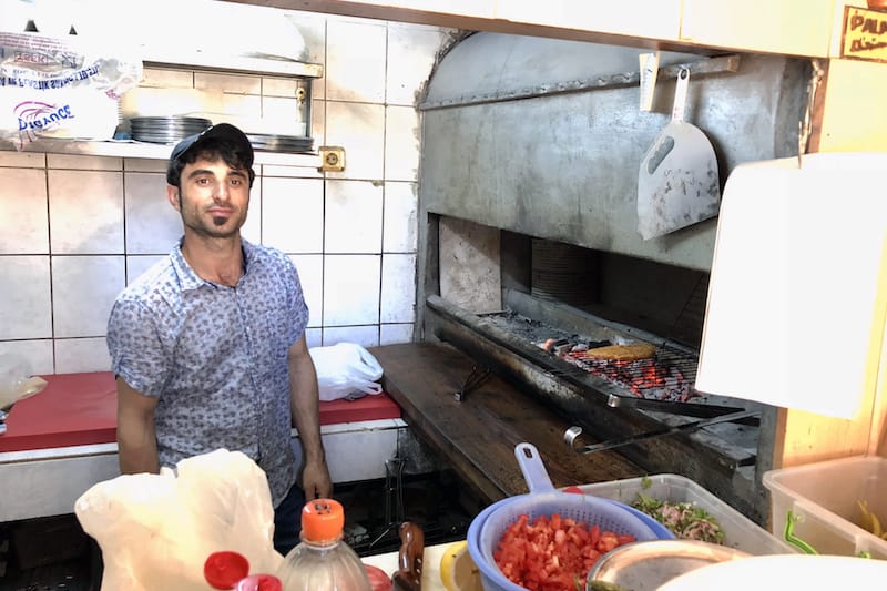 One of the members of the Oğur family, the owners of Şato Dürüm Evi, tends the grill, photo by Paul Benjamin Osterlund