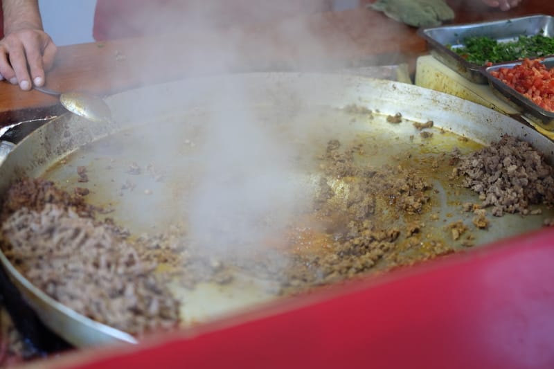 The beef for tantuni is fried inside a vast, shallow metal pan known as a sac, photo by Paul Osterlund