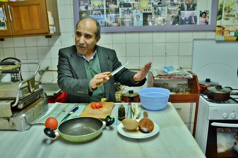 İsmail Amca, with his "wall of fame" in the background, photo by İpek Derin Baltutan