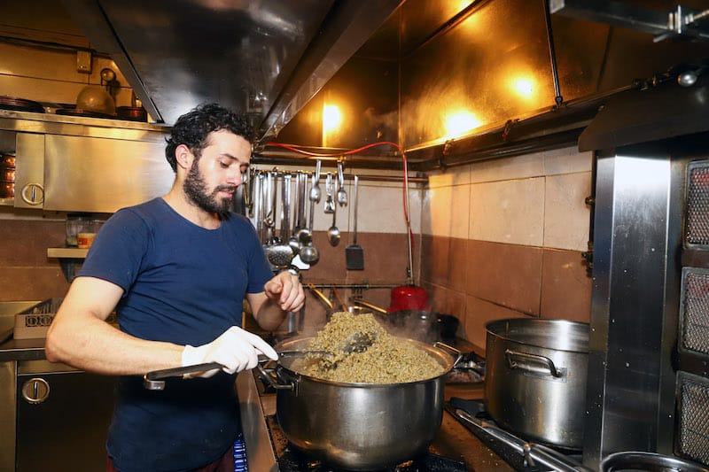A cook in the kitchen at Vezir Han, a Syrian restaurant in Istanbul, photo by Dima Al Sayed