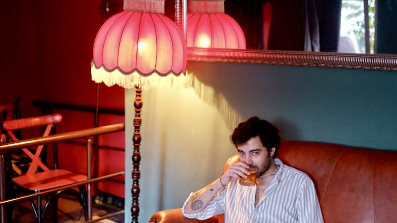 Metincan on Marlen's iconic couch, photo by Paul Benjamin Osterlund