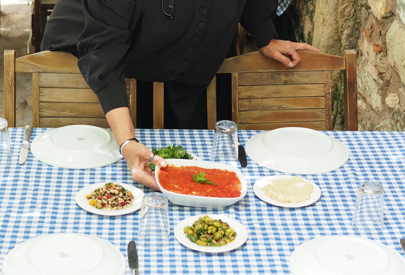 woman putting meze on table in istanbul