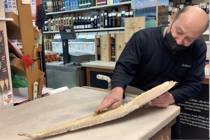 Senhor Rui shows off bacalhau at Pérola do Arsenal in Lisbon, photo by Célia Pedroso