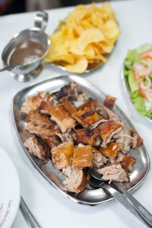 A dish of roast suckling pig, Bota Feijão, Lisbon, photo by Austin Bush