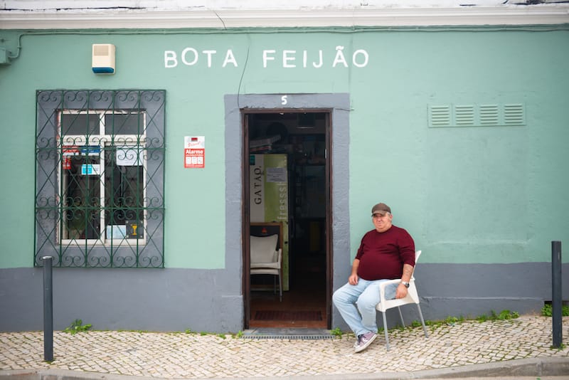 Pedro Pereira’s father in front of his restaurant, Bota Feijão, Lisbon, photo by Austin Bush