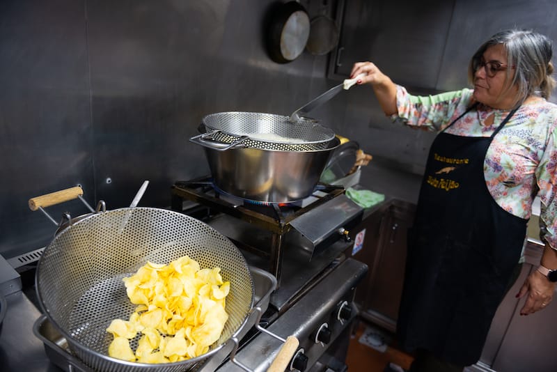 Pedro Pereira’s mother frying chips at Bota Feijão, Lisbon, photo by Austin Bush
