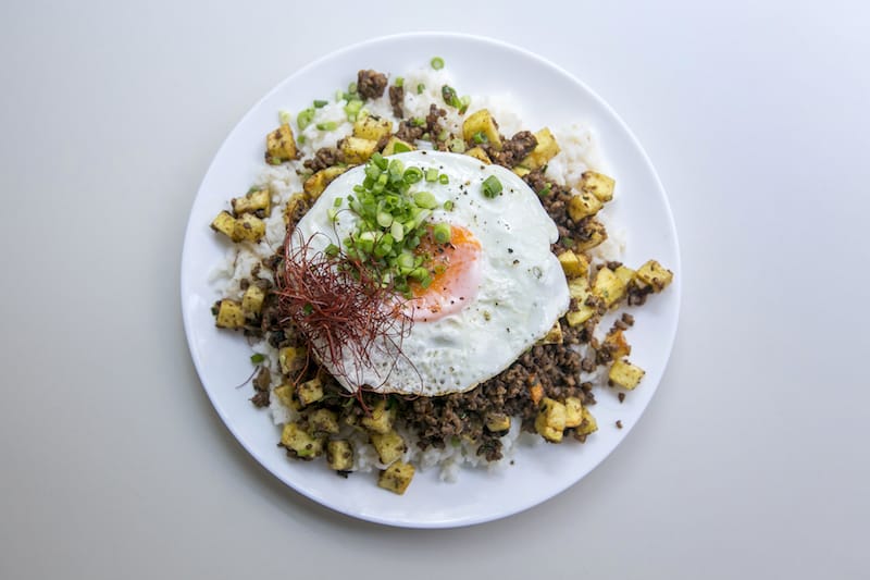 Minchi, a Macanese dish of rice, cubed fried potatoes and minced meat with a fried egg on top, photo by Rodrigo Cabrita