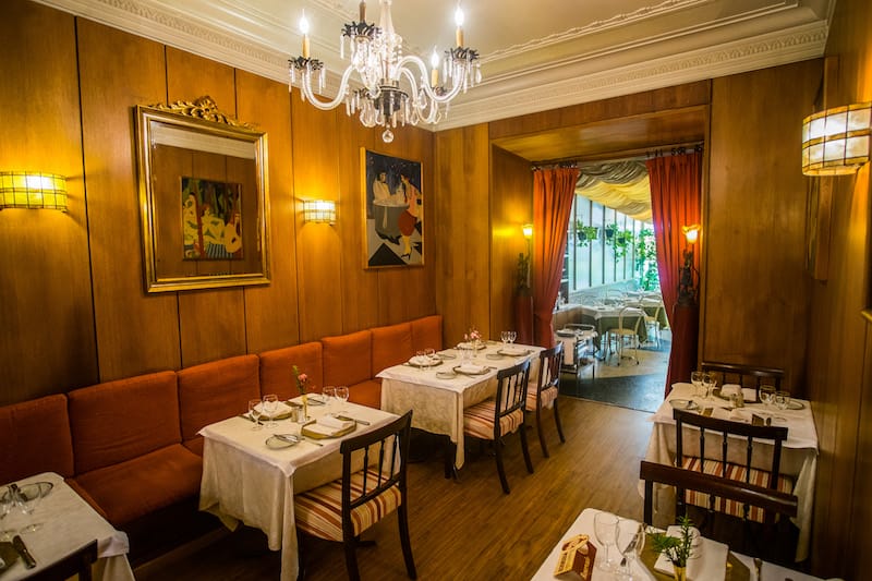 The wood-paneled interior of Petite Folie, photo by Tiago Pais