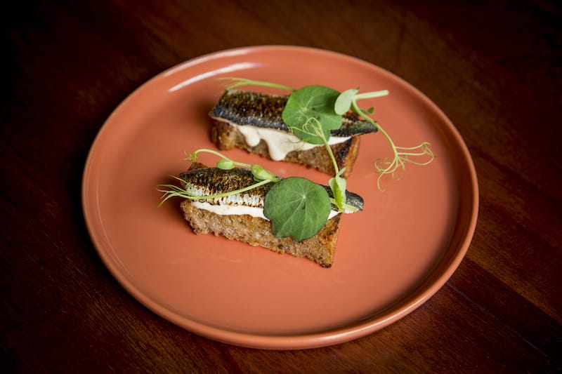 Toast topped with sardines marinated in Jerez vinegar and comté cheese at Tati in Lisbon, photo by Rodrigo Cabrita