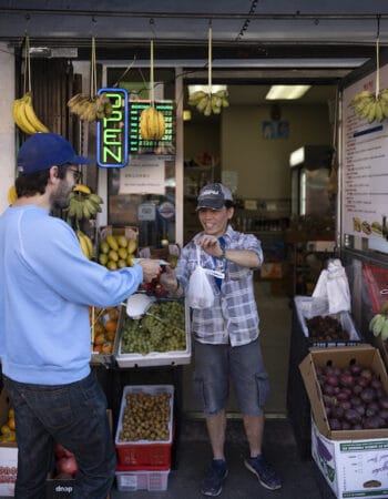 Ethan ordering from a Vietnamese grocer, photo by Julien Lasseur