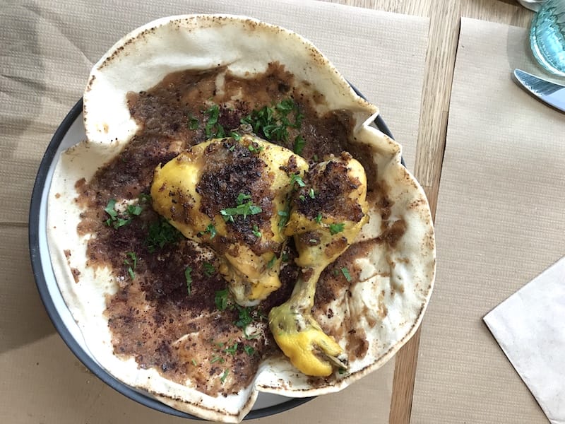 Mousakhan, Palestinean roast chicken served on a thin flatbread, at Mouné, photo by Alexis Steinman